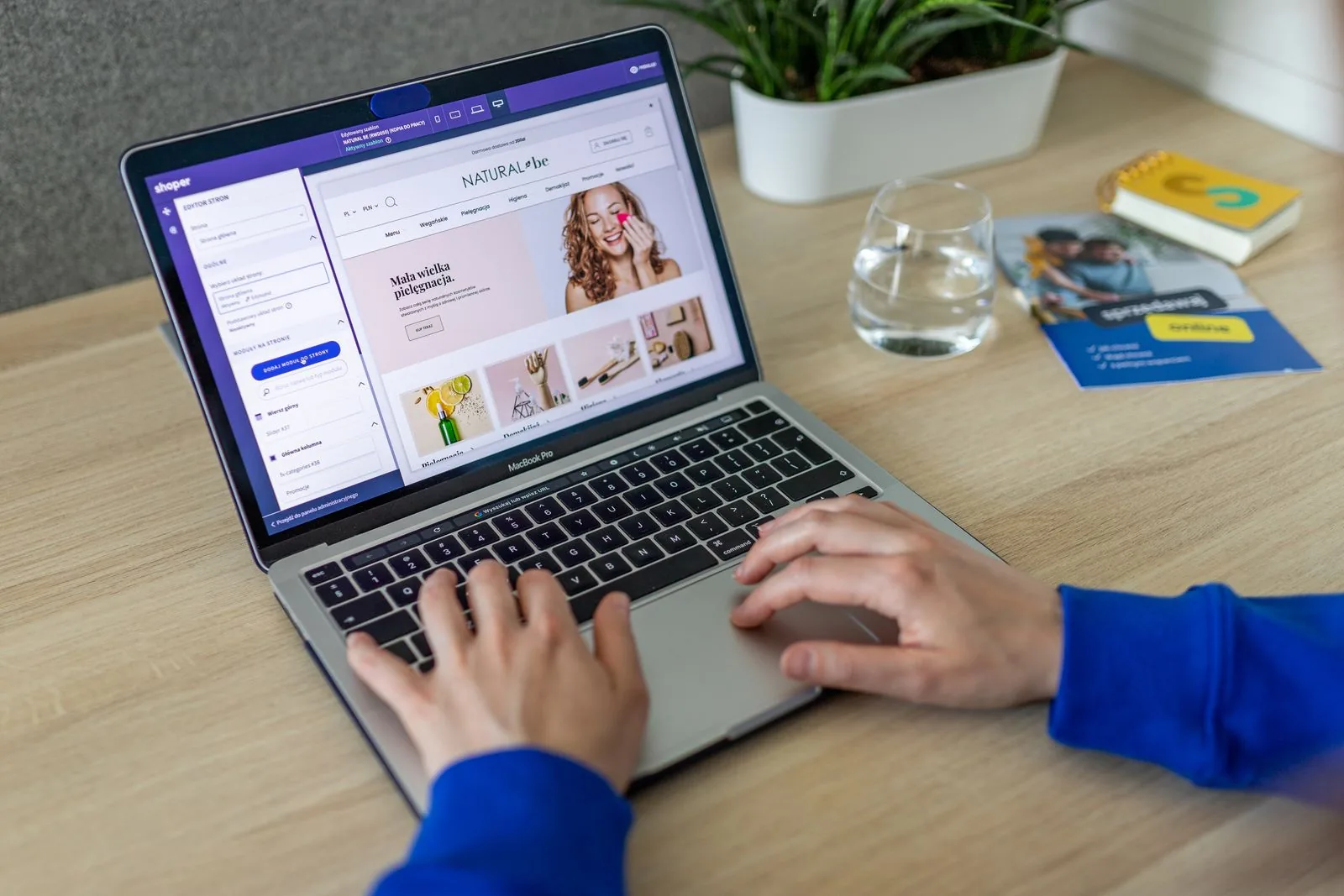 Laptop on a desk showing an online shop editor
